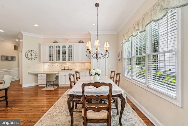 20369 Stillhouse Branch Pl, Sterling, VA 20165 - dining room with crown molding, dark wood finished floors, a chandelier, and recessed lighting