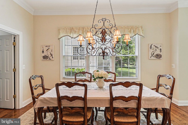 20369 Stillhouse Branch Pl, Sterling, VA 20165 - dining space featuring a chandelier, crown molding, dark wood-style flooring, and baseboards