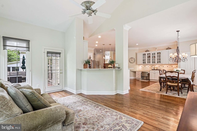 20369 Stillhouse Branch Pl, Sterling, VA 20165 - living area with wood finished floors, a ceiling fan, a chandelier, ornamental molding, and recessed lighting