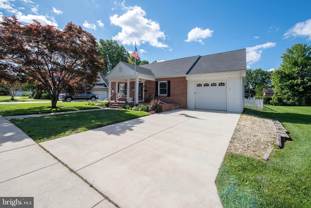 714 Alliance St, Havre De Grace, MD 21078 - view of front of house with an attached garage, a front lawn, driveway, a porch, and brick siding