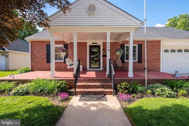 714 Alliance St, Havre De Grace, MD 21078 - view of front facade featuring brick siding, covered porch, a garage, and a shingled roof