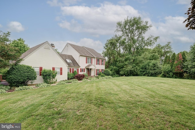 208 E Bradford Ct, Middletown, DE 19709 - view of front of house featuring a front lawn and a chimney