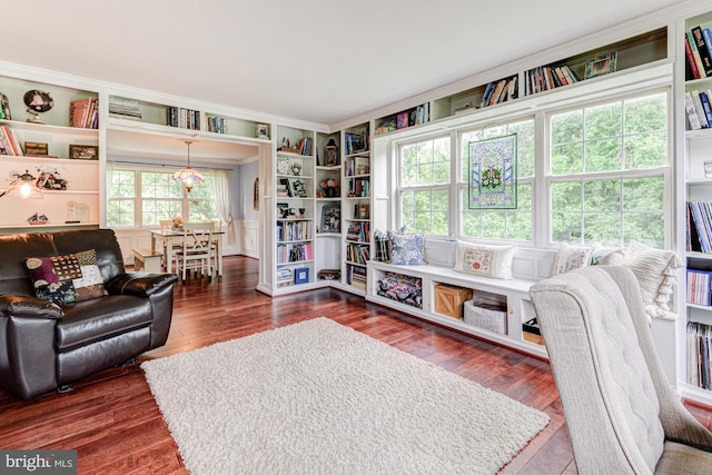 208 E Bradford Ct, Middletown, DE 19709 - living room with ornamental molding, dark wood-style floors, and built in features