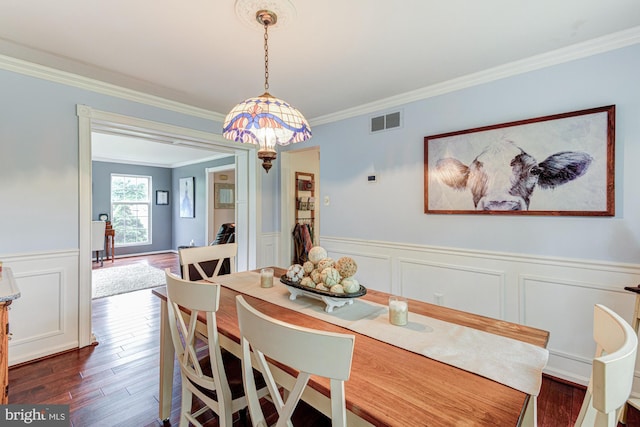 208 E Bradford Ct, Middletown, DE 19709 - dining area featuring ornamental molding, dark wood finished floors, a wainscoted wall, and a decorative wall