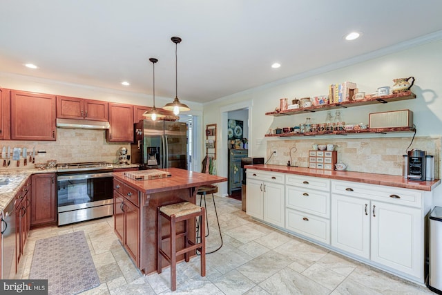 208 E Bradford Ct, Middletown, DE 19709 - kitchen with stainless steel appliances, butcher block counters, decorative backsplash, under cabinet range hood, and crown molding