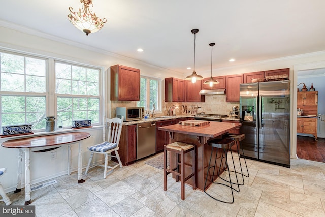 208 E Bradford Ct, Middletown, DE 19709 - kitchen featuring stainless steel appliances, wooden counters, ornamental molding, a sink, and decorative backsplash