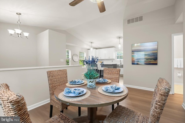 808 Pasadena Ave, Severna Park, MD 21146 - dining room with wood finished floors, a chandelier, baseboards, ceiling fan, and vaulted ceiling