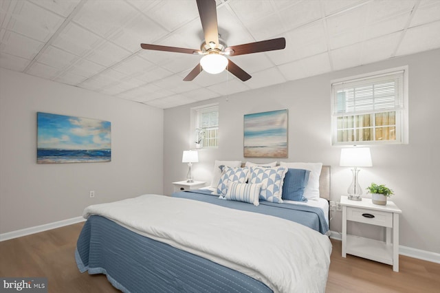 808 Pasadena Ave, Severna Park, MD 21146 - bedroom featuring wood finished floors, multiple windows, and baseboards