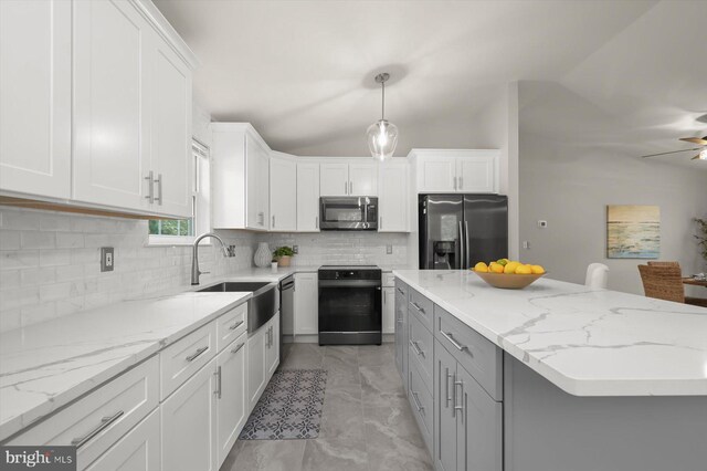 808 Pasadena Ave, Severna Park, MD 21146 - kitchen featuring appliances with stainless steel finishes, a sink, white cabinets, decorative backsplash, and light stone countertops