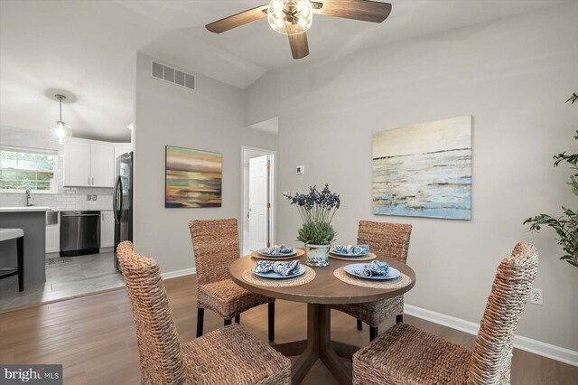 808 Pasadena Ave, Severna Park, MD 21146 - dining area with a ceiling fan, baseboards, light wood finished floors, and vaulted ceiling