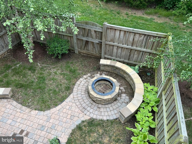 23294 Evening Primrose Sq, Brambleton, VA 20148 - fenced backyard with a fire pit and a gate