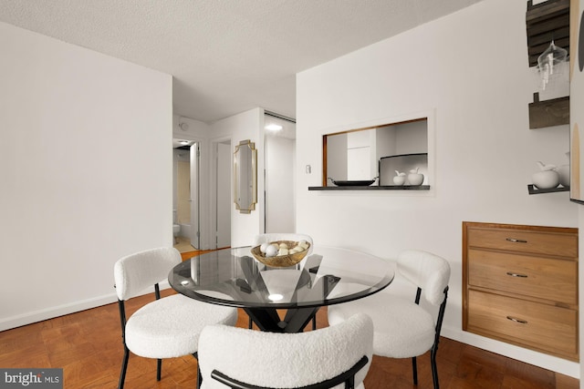 1301 20th St NW Unit 312, Washington, DC 20036 - dining space with baseboards and wood finished floors