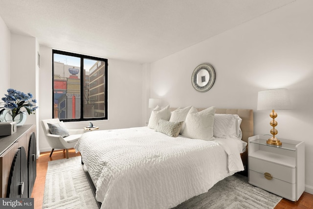 1301 20th St NW Unit 312, Washington, DC 20036 - bedroom featuring light wood finished floors and baseboards