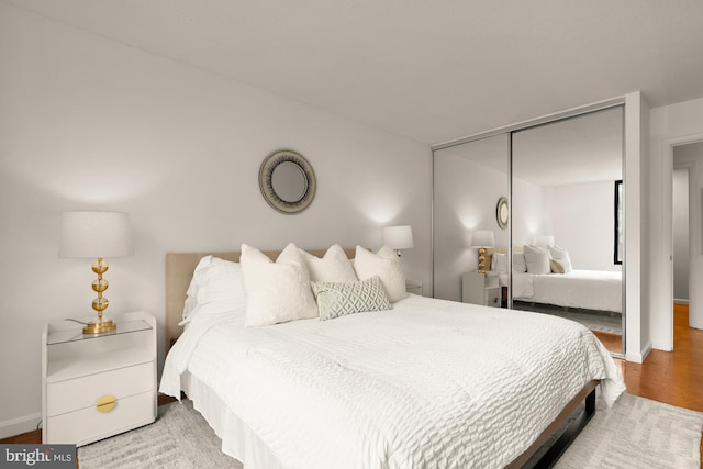 1301 20th St NW Unit 312, Washington, DC 20036 - bedroom featuring a closet and wood finished floors