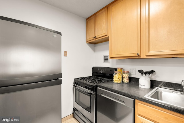 1301 20th St NW Unit 312, Washington, DC 20036 - kitchen with stainless steel appliances, dark countertops, and light tile patterned flooring