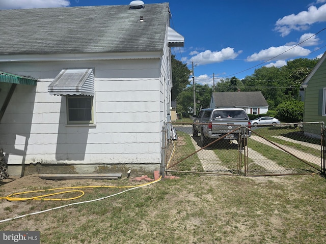 408 Dover St, Salisbury, MD 21804 - view of side of home featuring a shingled roof and a gate