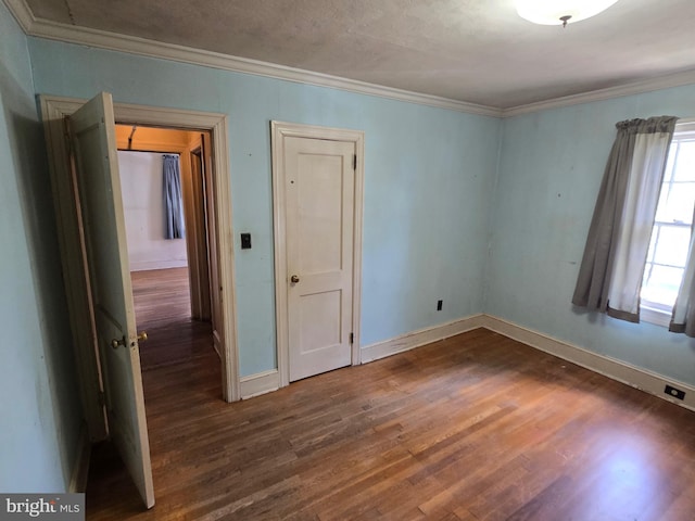 408 Dover St, Salisbury, MD 21804 - spare room featuring crown molding, wood finished floors, and baseboards