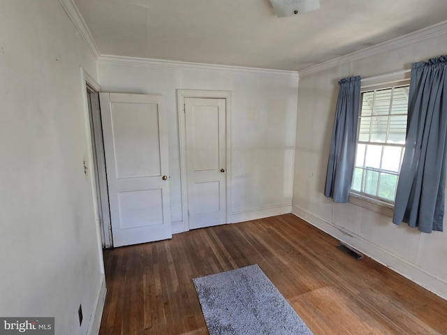 408 Dover St, Salisbury, MD 21804 - unfurnished bedroom with wood finished floors, crown molding, and baseboards