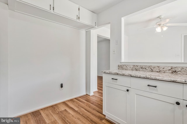 24 Helen Ct, Indian Head, MD 20640 - kitchen with light wood-style floors, a ceiling fan, white cabinets, and light stone counters