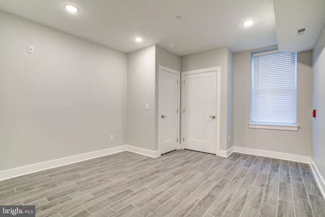 5005 Walnut St, Philadelphia, PA 19139 - spare room featuring baseboards, light wood finished floors, and recessed lighting