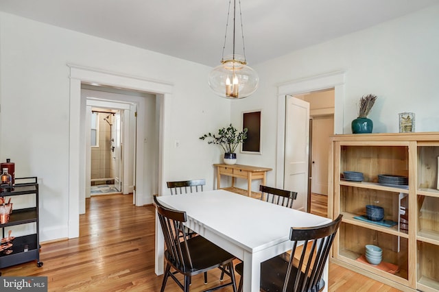815 Aspen St NW, Washington, DC 20012 - dining room featuring light wood-style floors and baseboards