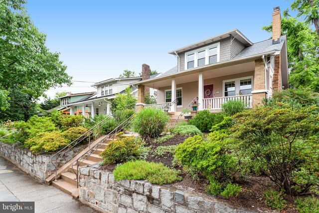 815 Aspen St NW, Washington, DC 20012 - bungalow featuring a porch, stairway, and a chimney