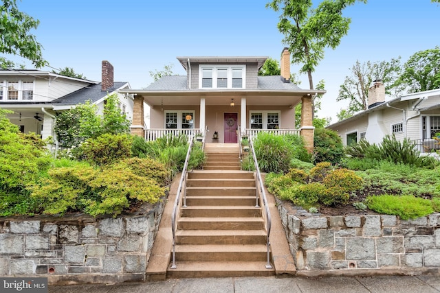815 Aspen St NW, Washington, DC 20012 - bungalow-style home featuring stairway, covered porch, and a chimney
