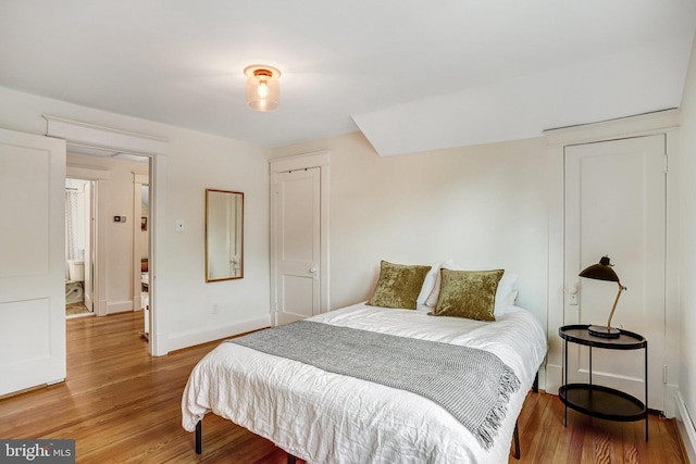815 Aspen St NW, Washington, DC 20012 - bedroom featuring light wood-style flooring and baseboards