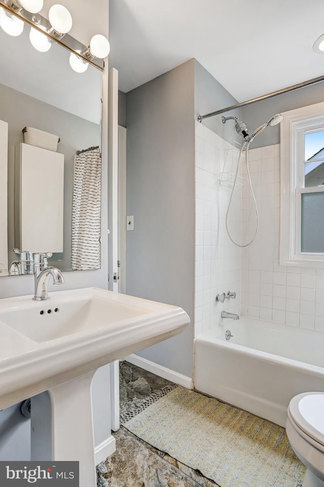 815 Aspen St NW, Washington, DC 20012 - bathroom with toilet, bathtub / shower combination, tile patterned floors, and a sink