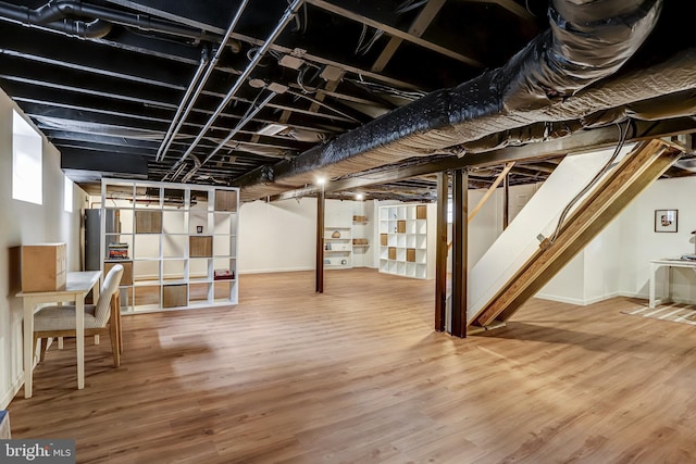815 Aspen St NW, Washington, DC 20012 - below grade area featuring stairs, wood finished floors, and baseboards