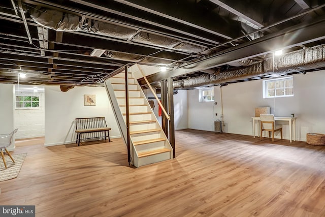 815 Aspen St NW, Washington, DC 20012 - basement with stairway, wood finished floors, and healthy amount of natural light