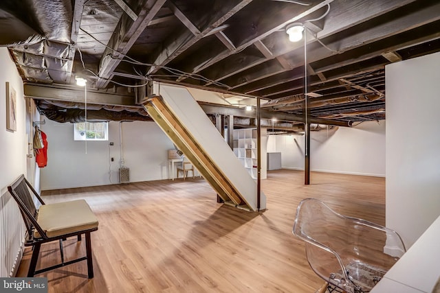 815 Aspen St NW, Washington, DC 20012 - basement with stairs and wood finished floors