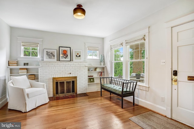 815 Aspen St NW, Washington, DC 20012 - living area with wood finished floors, baseboards, and a fireplace