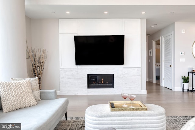 1330 Lancaster St Unit C701, Baltimore, MD 21231 - living area with wood finished floors, a fireplace, baseboards, and recessed lighting