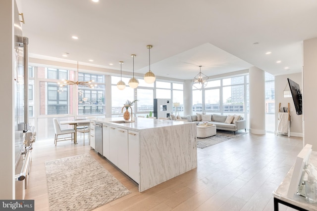 1330 Lancaster St Unit C701, Baltimore, MD 21231 - kitchen with a chandelier, healthy amount of natural light, light wood-style floors, white cabinetry, and recessed lighting