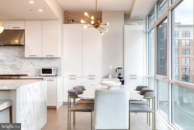 1330 Lancaster St Unit C701, Baltimore, MD 21231 - dining area featuring a chandelier, light wood-style floors, and recessed lighting