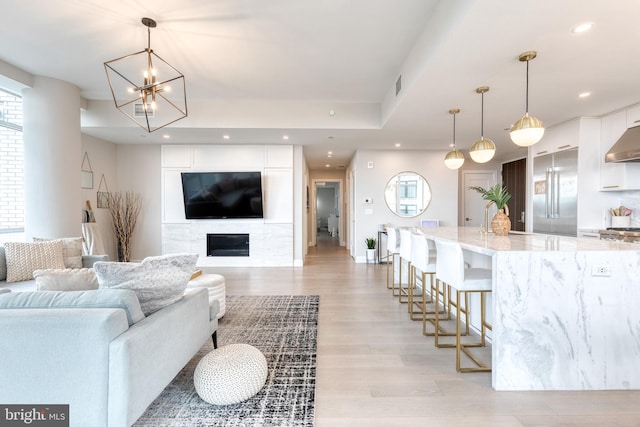 1330 Lancaster St Unit C701, Baltimore, MD 21231 - living area featuring light wood-style flooring, plenty of natural light, a chandelier, recessed lighting, and baseboards