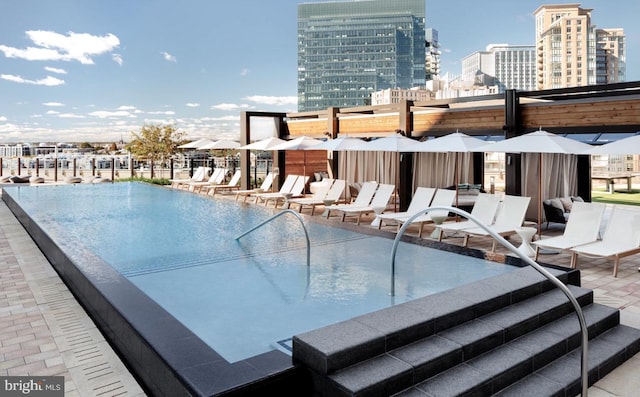 1330 Lancaster St Unit C701, Baltimore, MD 21231 - community pool featuring a view of city and a patio