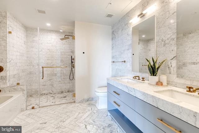 1330 Lancaster St Unit C701, Baltimore, MD 21231 - bathroom featuring a shower stall, a garden tub, double vanity, tile walls, and toilet