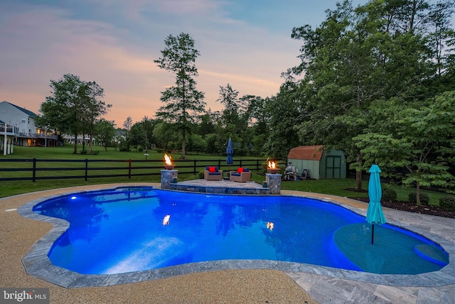 7633 Great Dover St, Gainesville, VA 20155 - view of swimming pool with a storage unit, view of scattered trees, and a patio area