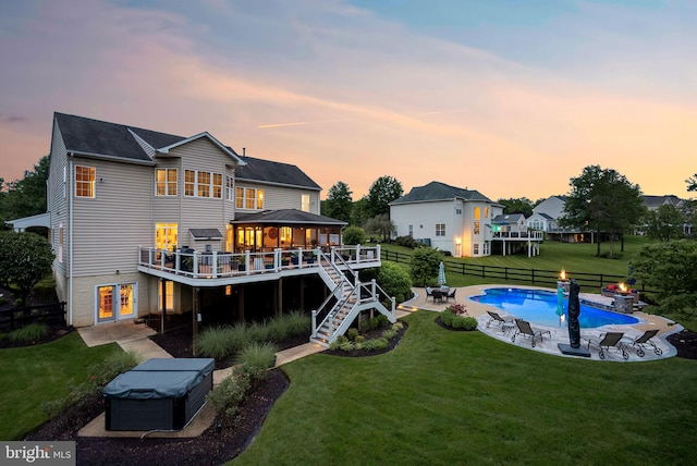 7633 Great Dover St, Gainesville, VA 20155 - back of property with a hot tub, a deck, a patio, an outdoor pool, and stairway