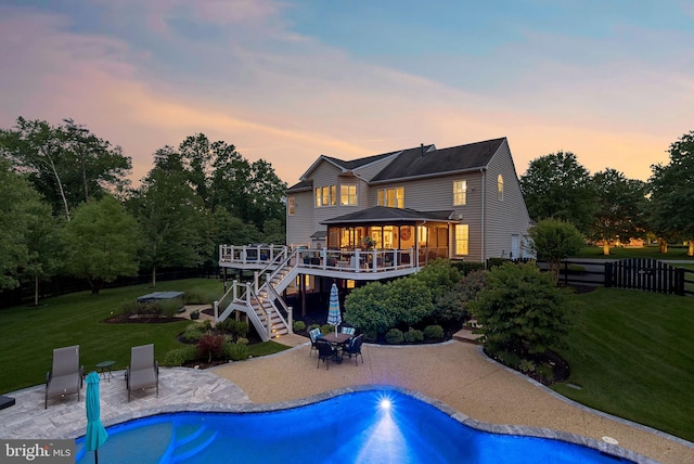 7633 Great Dover St, Gainesville, VA 20155 - back of property with a wooden deck, stairs, a patio area, and an outdoor pool