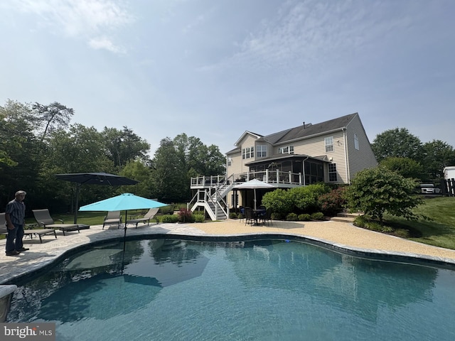 7633 Great Dover St, Gainesville, VA 20155 - outdoor pool with stairway, a deck, a patio, and a sunroom