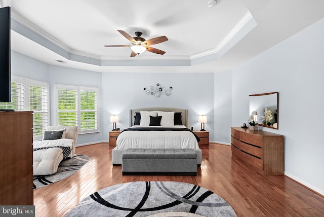 7633 Great Dover St, Gainesville, VA 20155 - bedroom featuring a raised ceiling, crown molding, wood finished floors, and ceiling fan