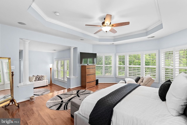 7633 Great Dover St, Gainesville, VA 20155 - bedroom with decorative columns, a raised ceiling, crown molding, wood finished floors, and a ceiling fan