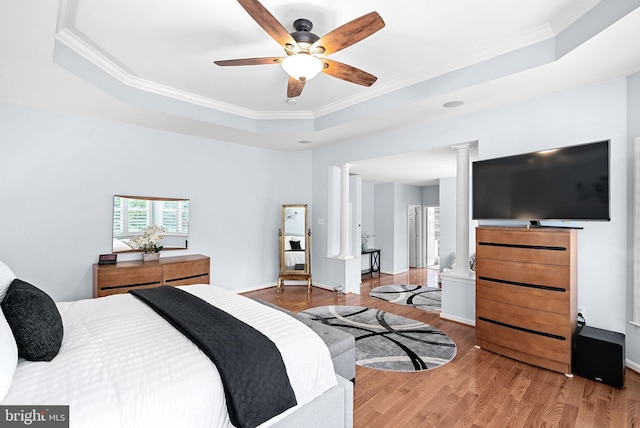 7633 Great Dover St, Gainesville, VA 20155 - bedroom with a tray ceiling, crown molding, wood finished floors, decorative columns, and a ceiling fan