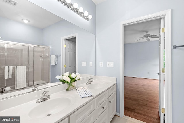 7633 Great Dover St, Gainesville, VA 20155 - full bath featuring double vanity, a tile shower, and ceiling fan