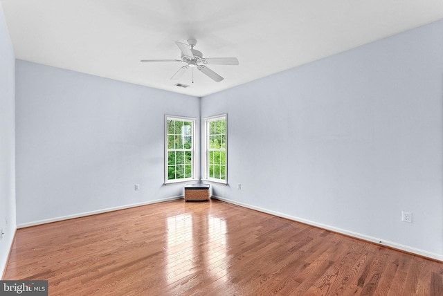 7633 Great Dover St, Gainesville, VA 20155 - empty room with wood finished floors and a ceiling fan