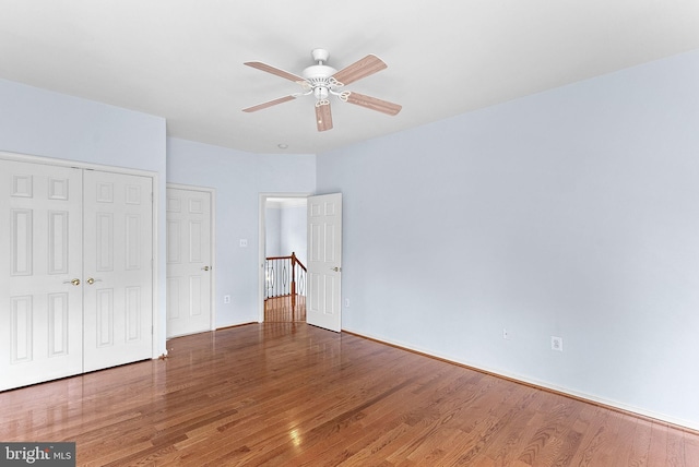 7633 Great Dover St, Gainesville, VA 20155 - unfurnished bedroom with wood finished floors, a closet, and ceiling fan
