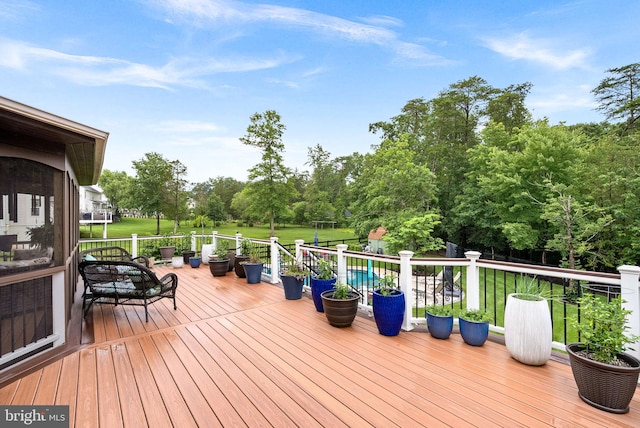 7633 Great Dover St, Gainesville, VA 20155 - deck featuring view of wooded area and a lawn